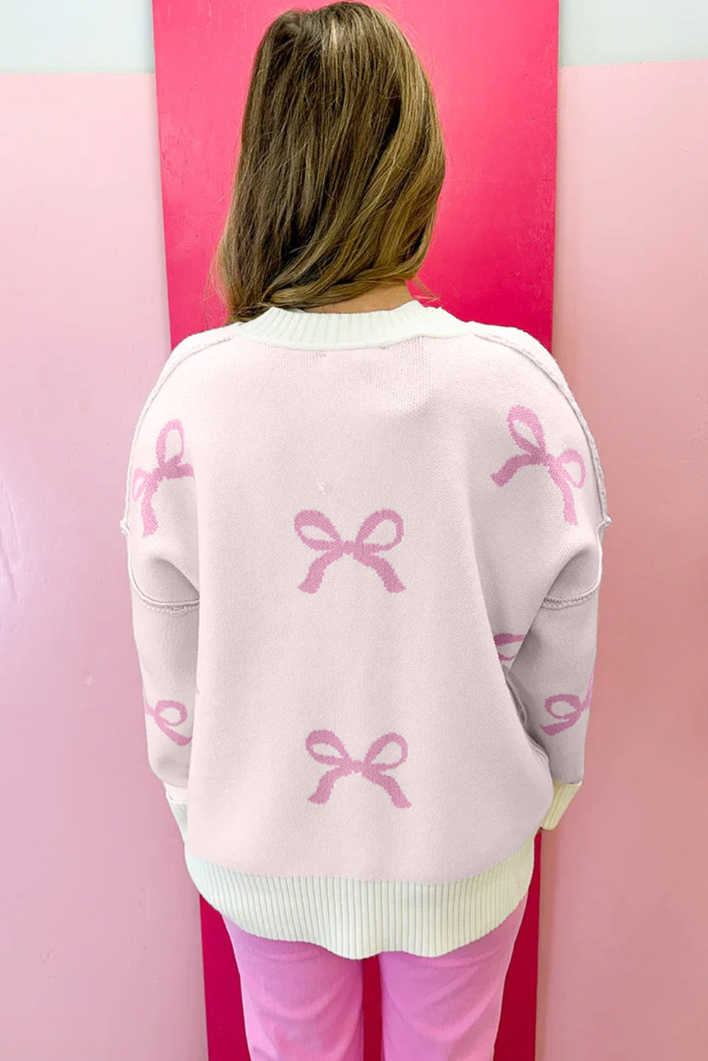 Pink Bow Print Exposed Seam Drop Sleeve Sweater